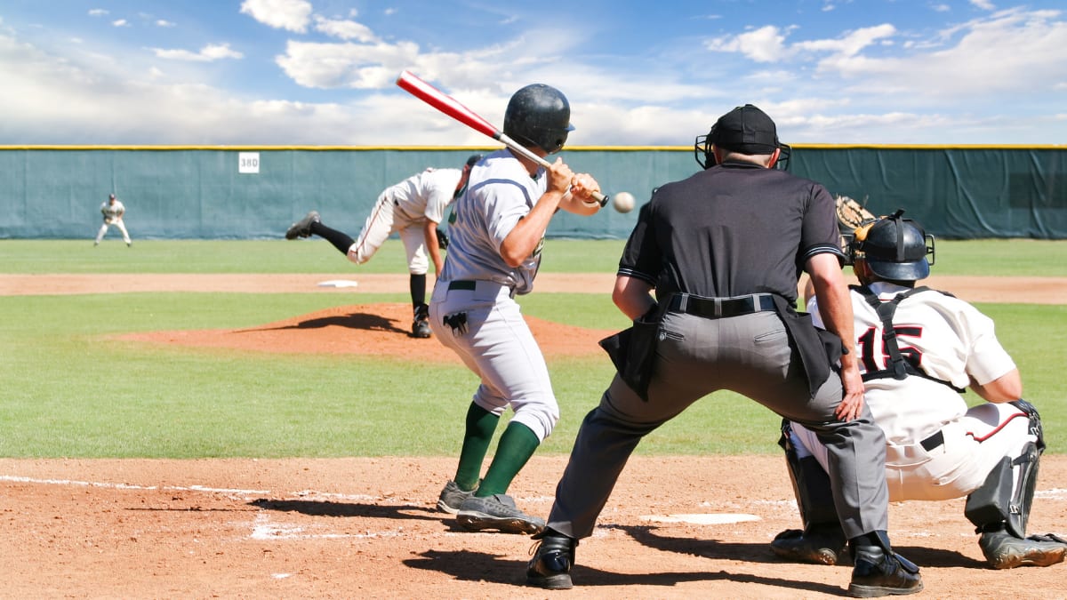 batter, umpire, and catcher waiting on a pitch from the pitcher