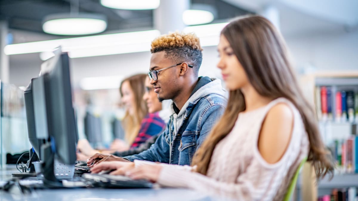 college students working on laptops