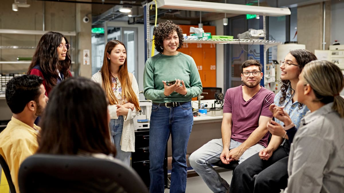 a group of college students standing in a lab