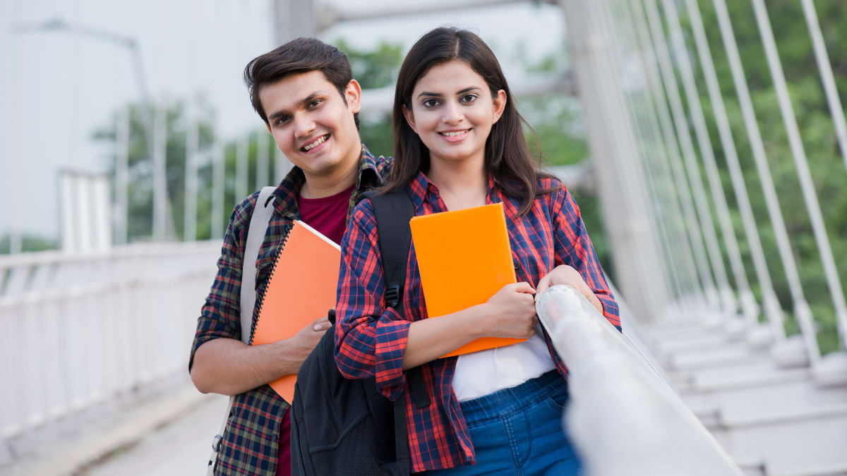 two college students standing together