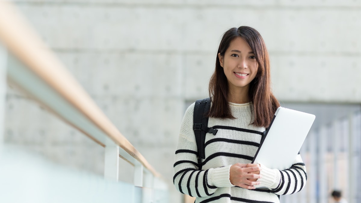 college student standing in a building on campus