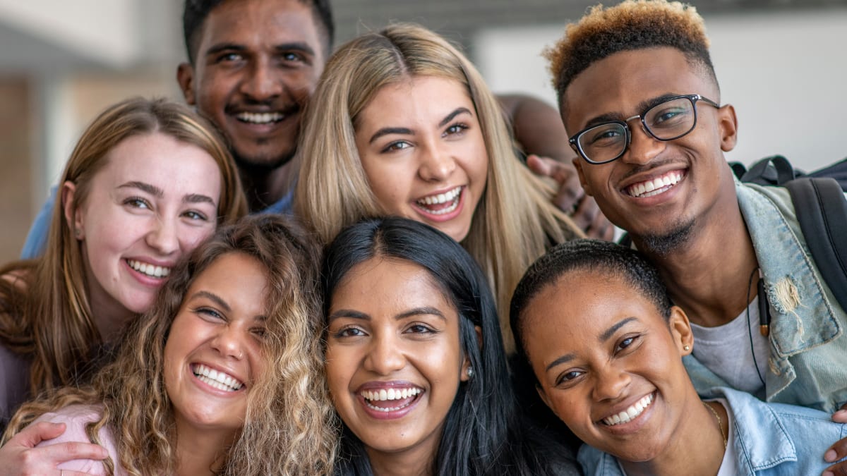 a group of college students smiling for a camera