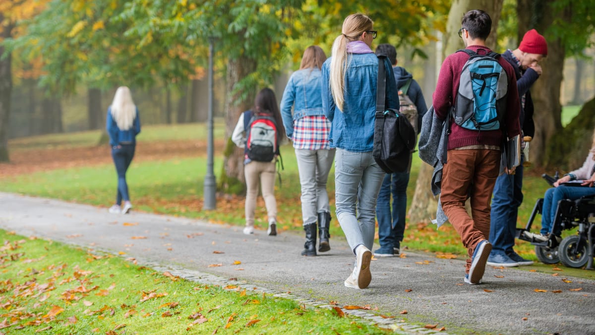 college students walking outside on a college campus