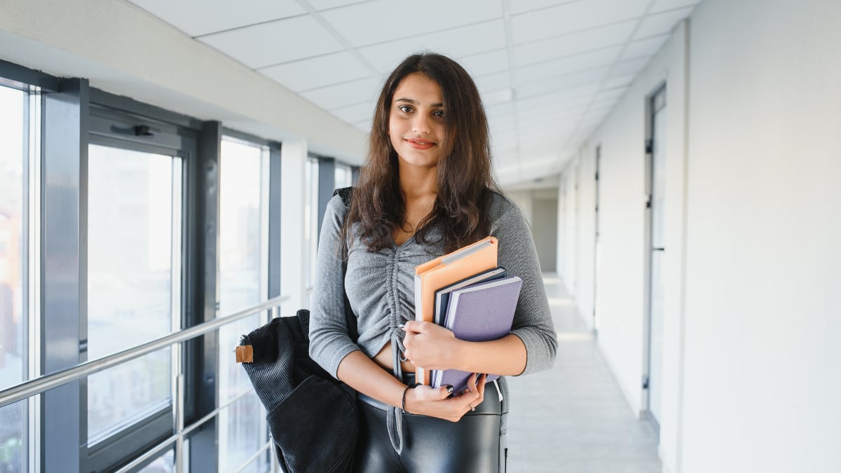 college student holding her textbooks