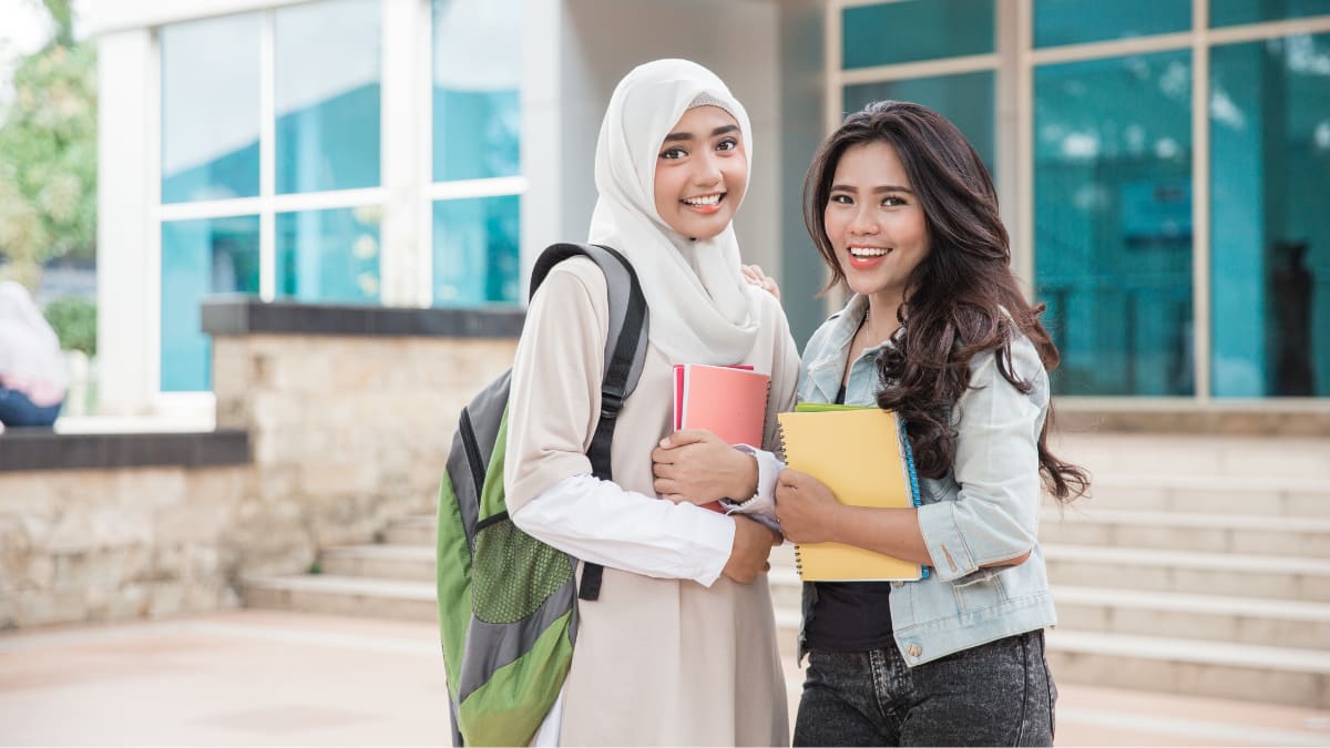 two college students standing together