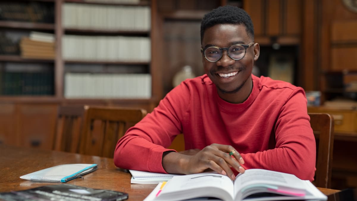 college student studying in a library