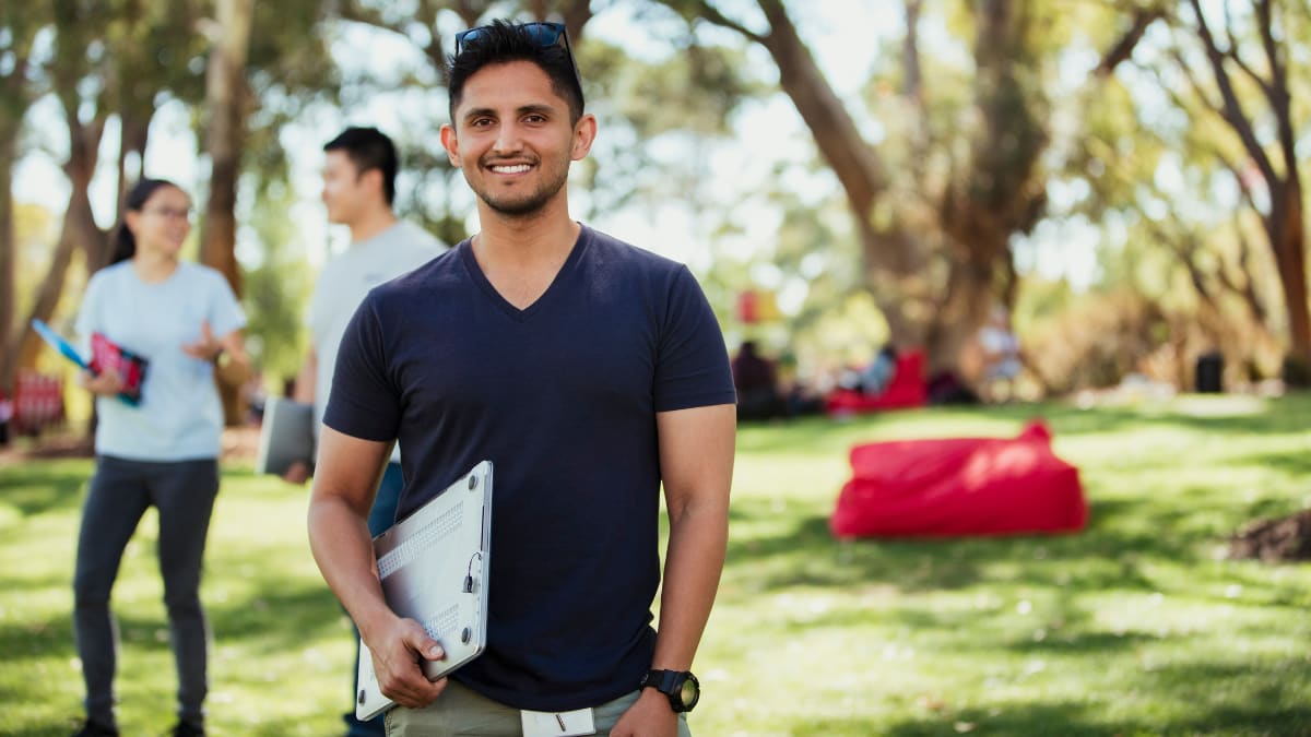 college student standing outside on a college campus