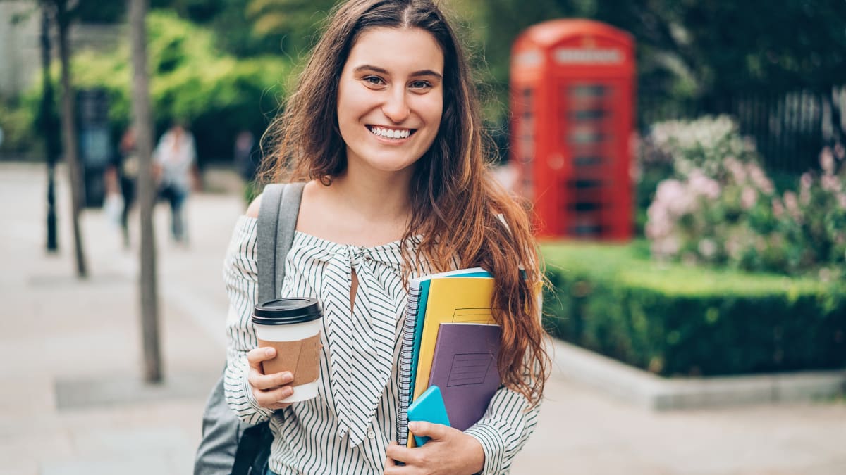 college student holding a drink