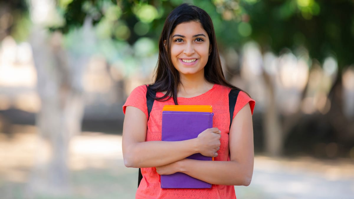 college student standing outside on a campus