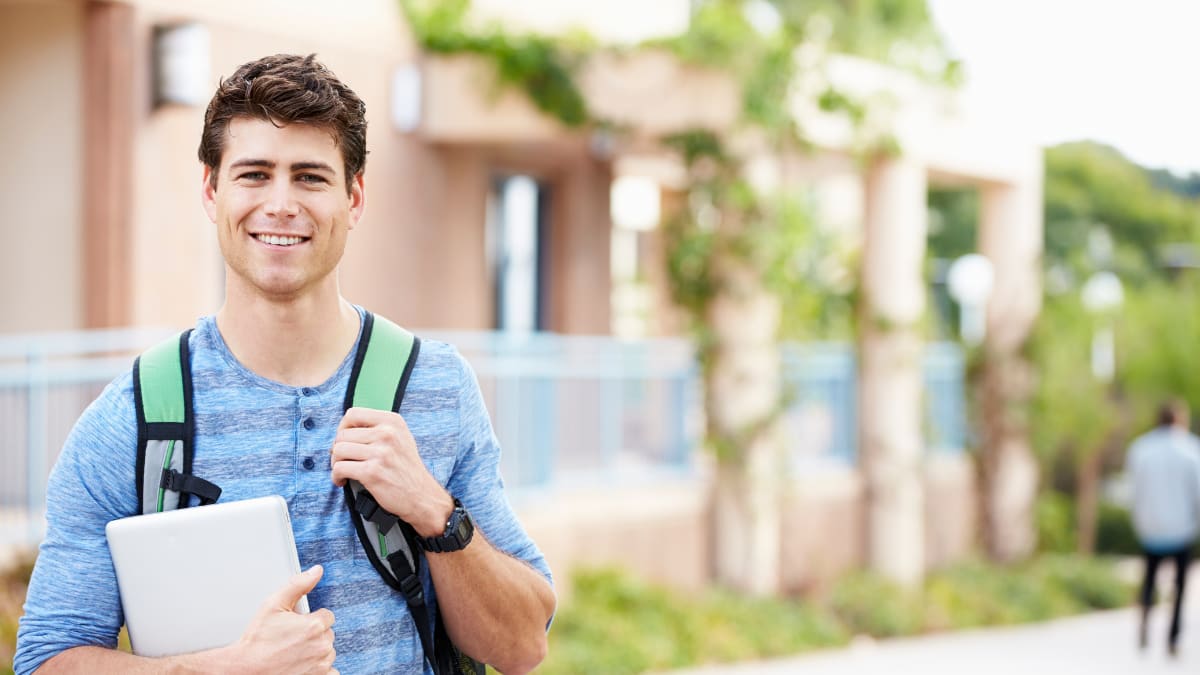 college student standing outside on a college campus