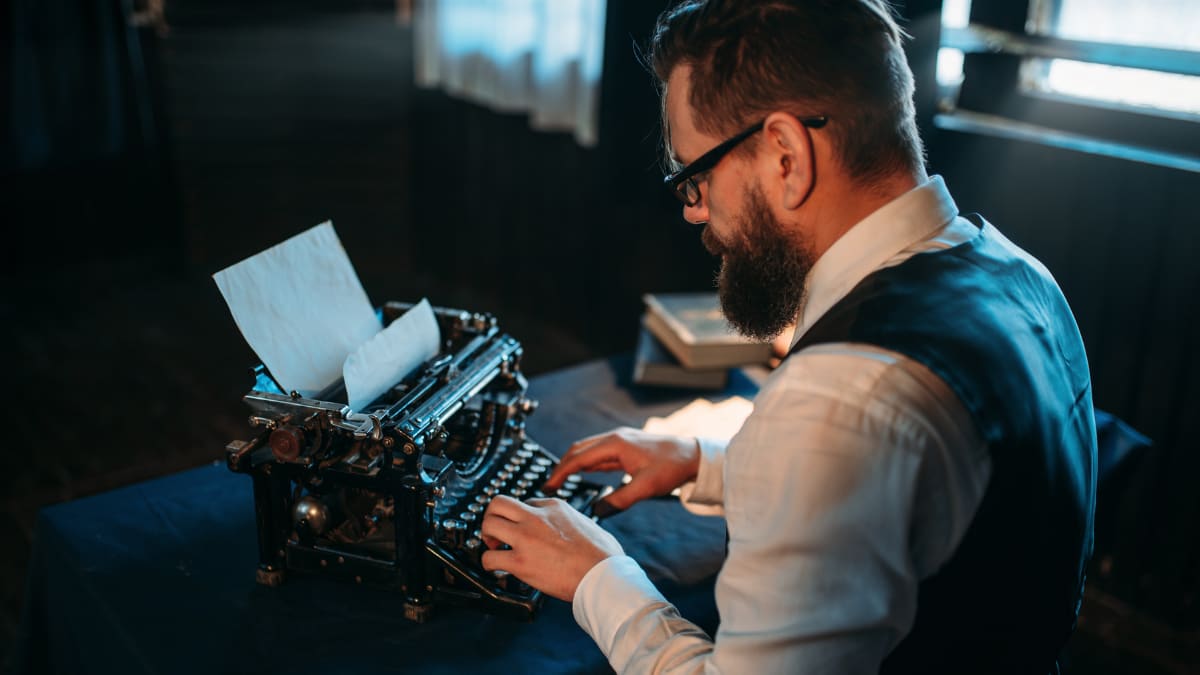 Author typing on a typewriter