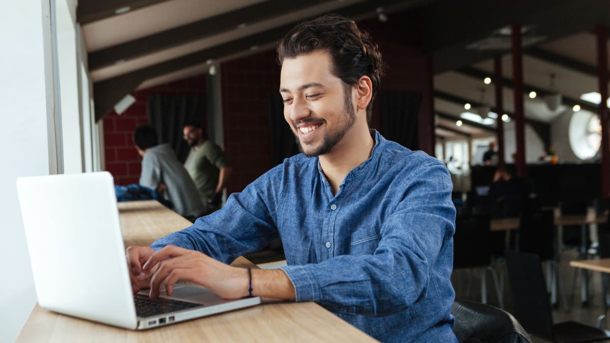 Author typing on a laptop