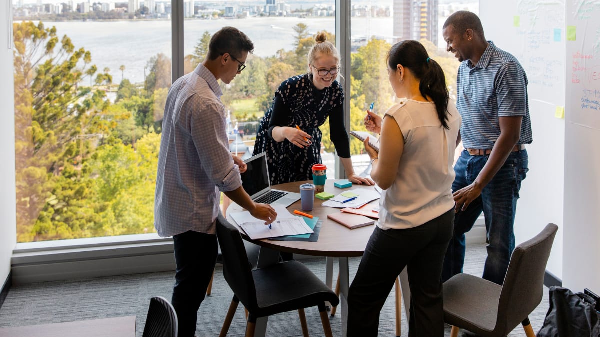 team of collaborative writers meeting together