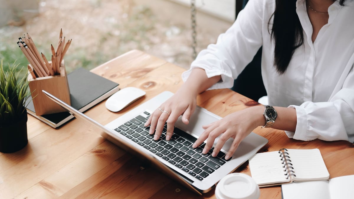 author typing on a laptop