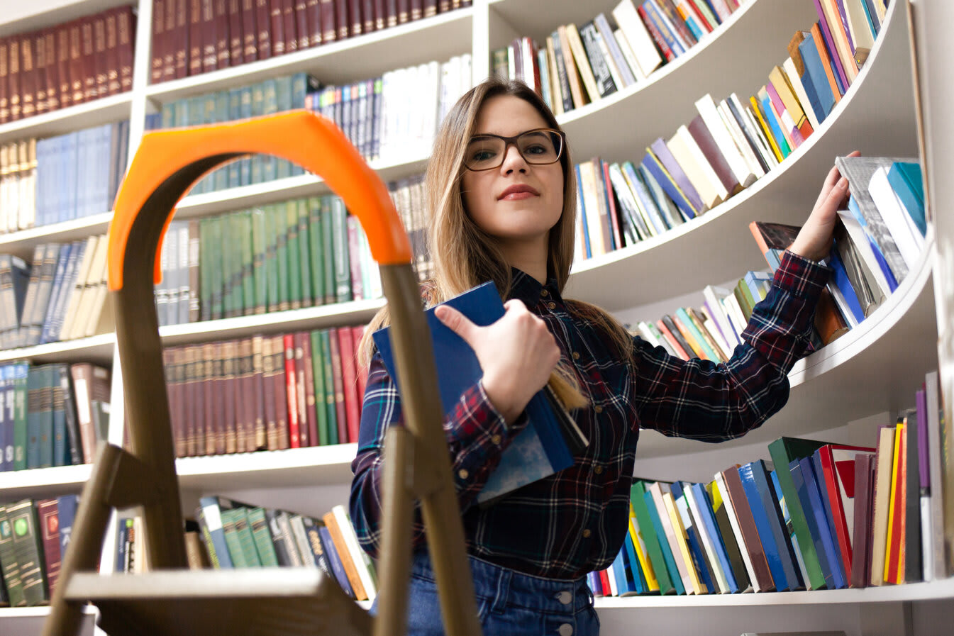 Woman with glasses in a library