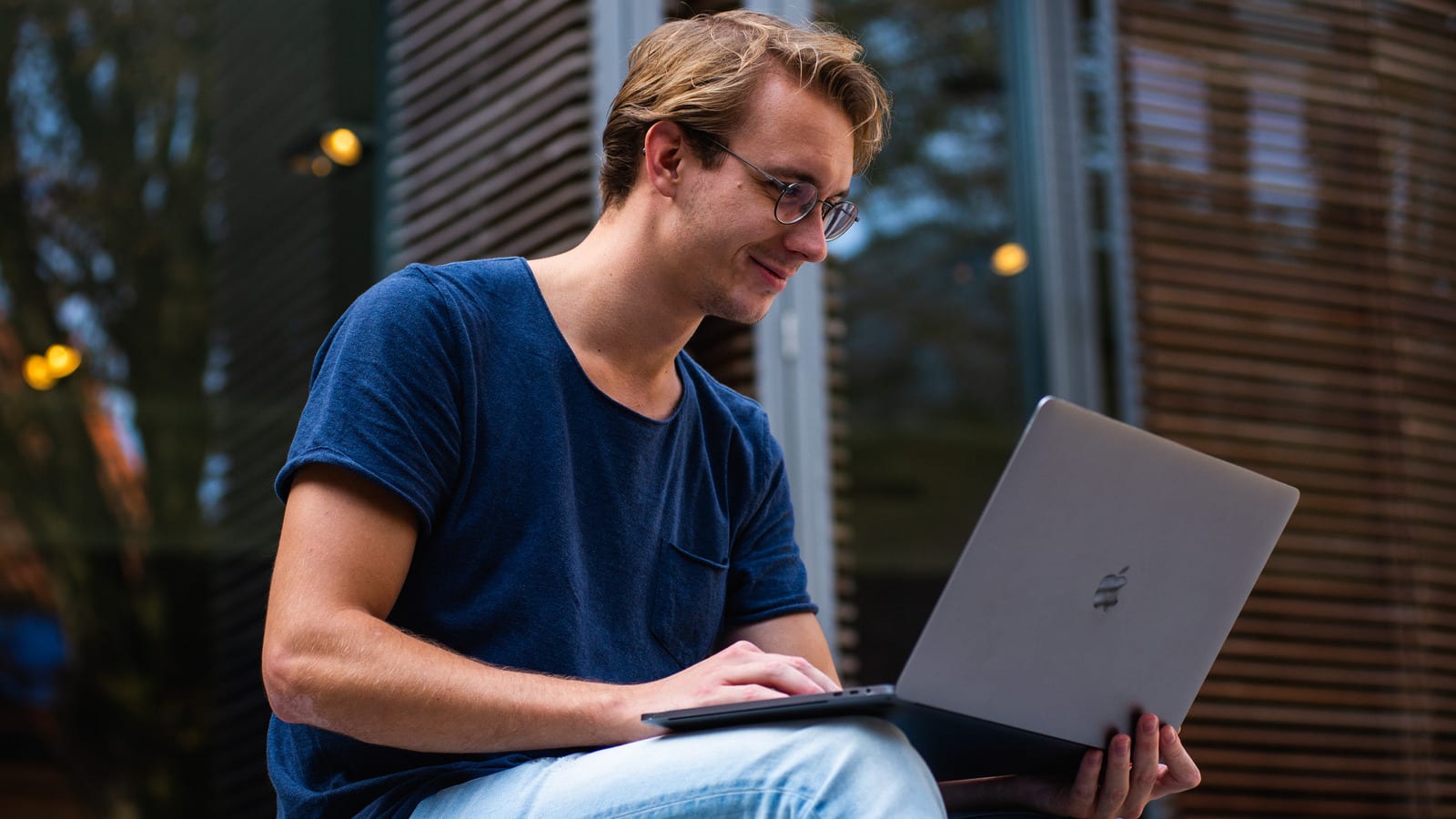 Male student studying outside