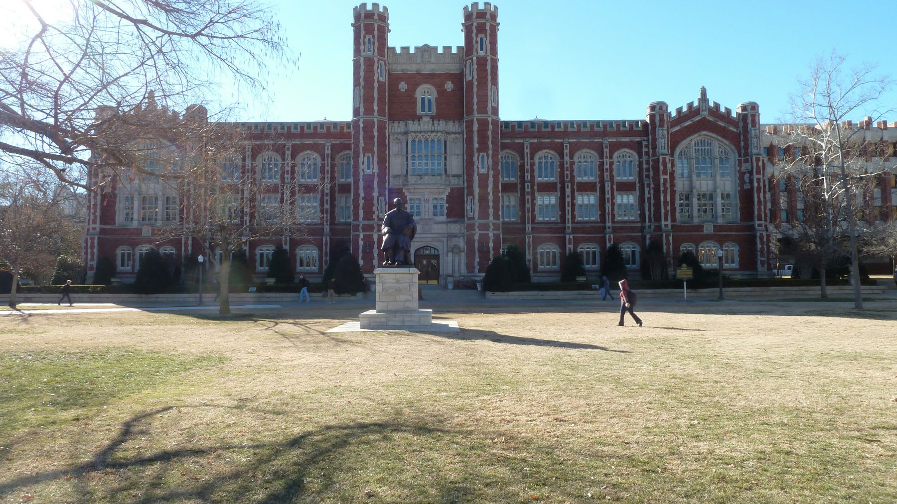 Students walking around the campus grounds of University of Oklahoma
