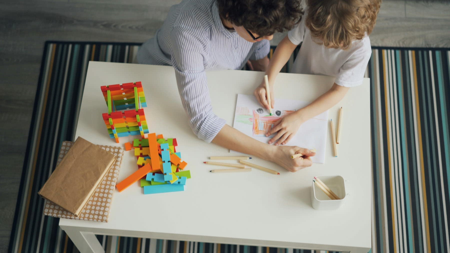 Woman playing together with a child