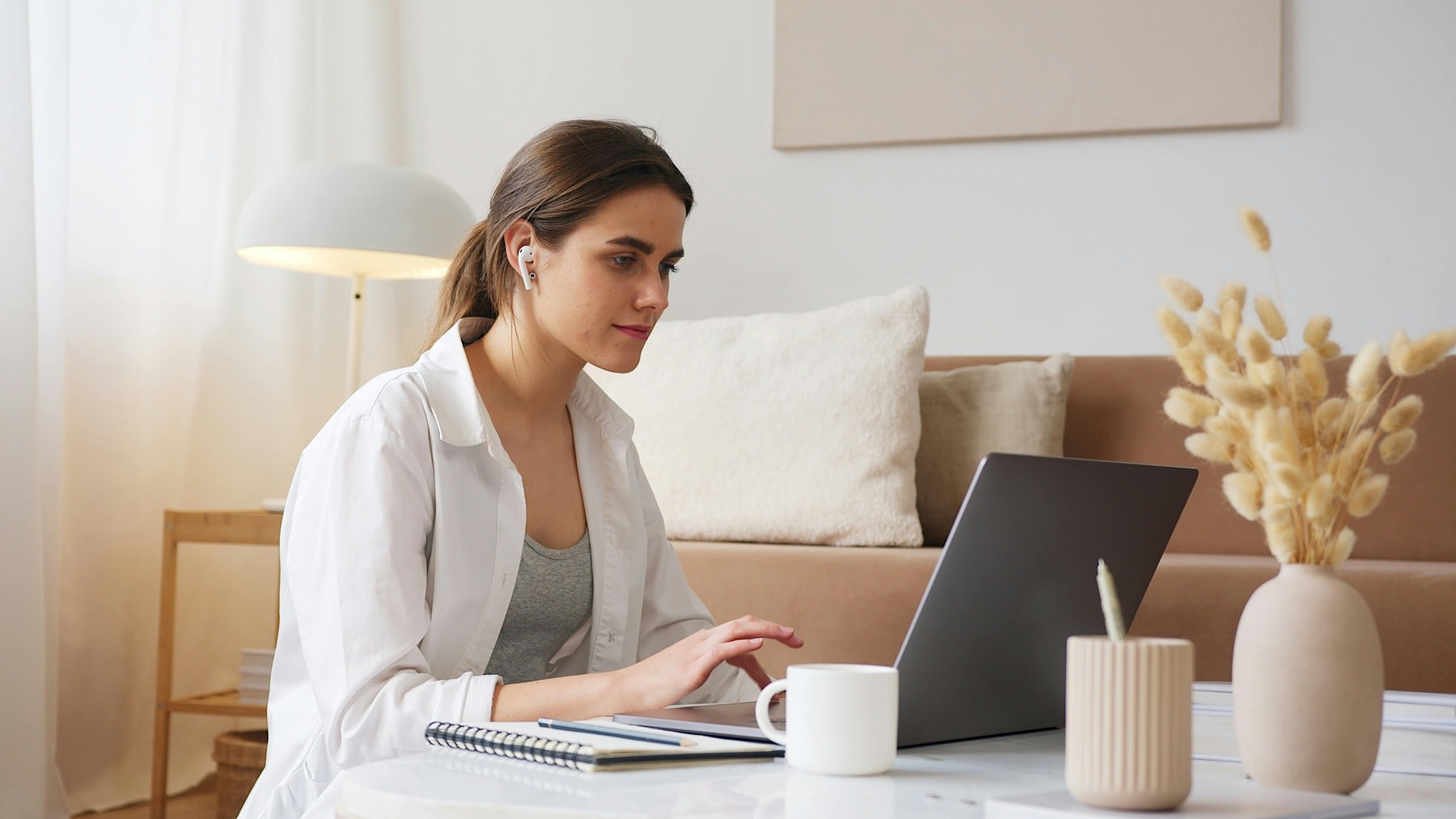 Woman using her computer while studying