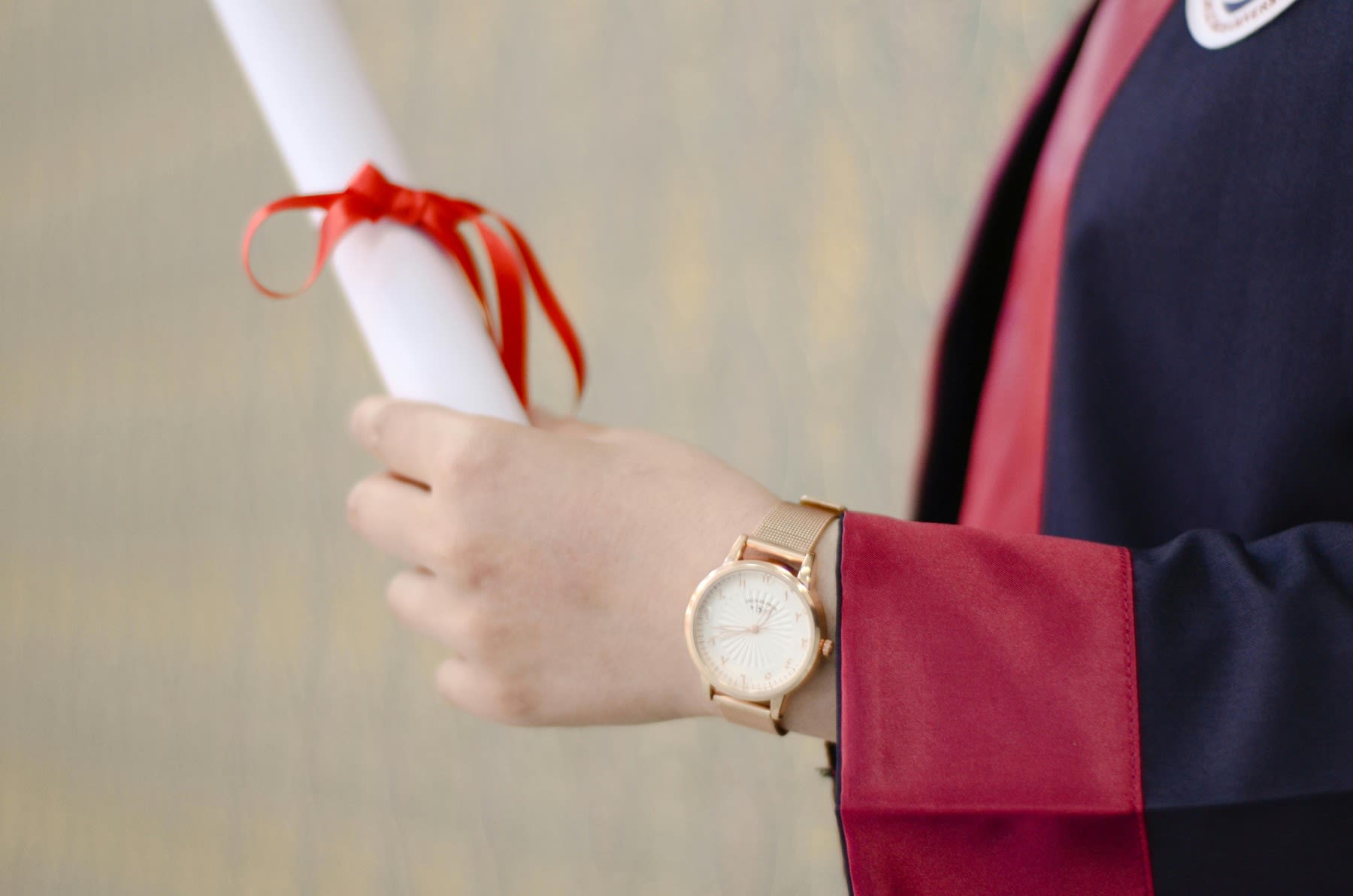 A student with his diploma on graduation day