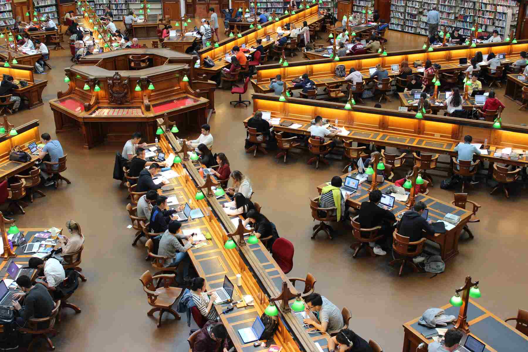 Library filled with students sitting on long tables