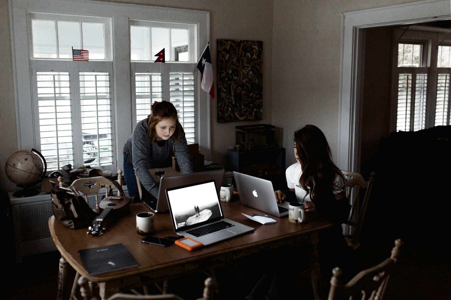 Two women using their laptops 