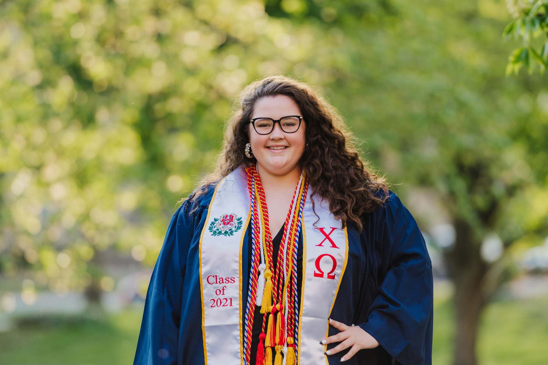Woman posing with her graduation robes