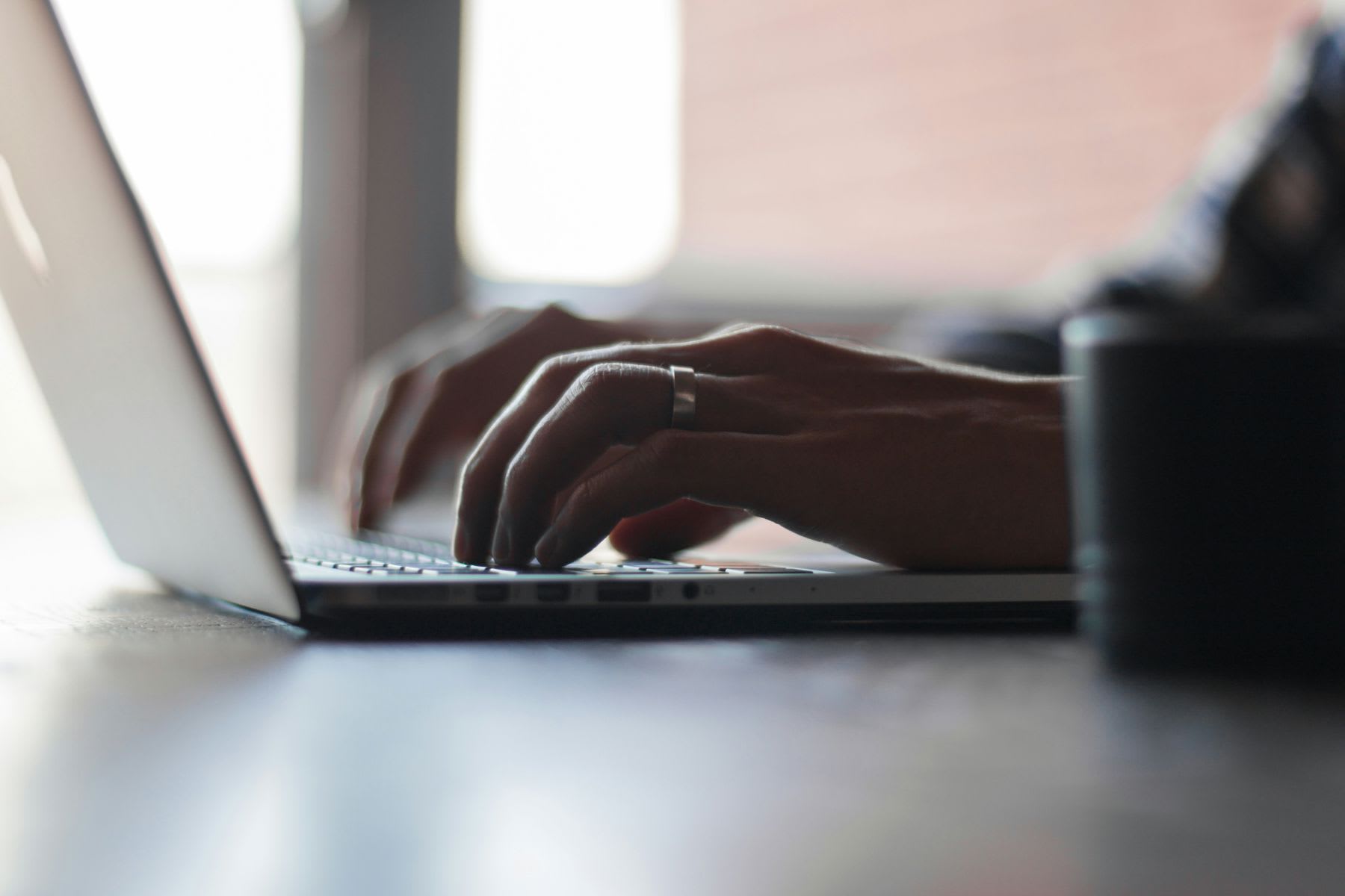 Woman typing in a laptop