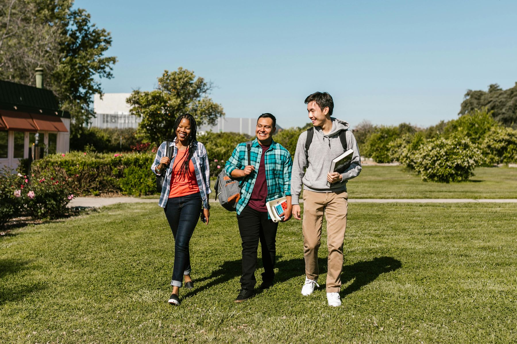 Students enjoying a walk around a school campus in between their classes