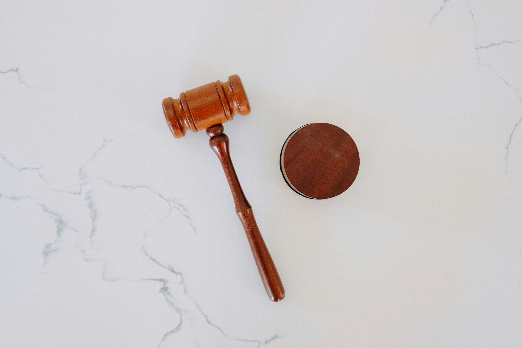 Wooden gavel and round block on the table