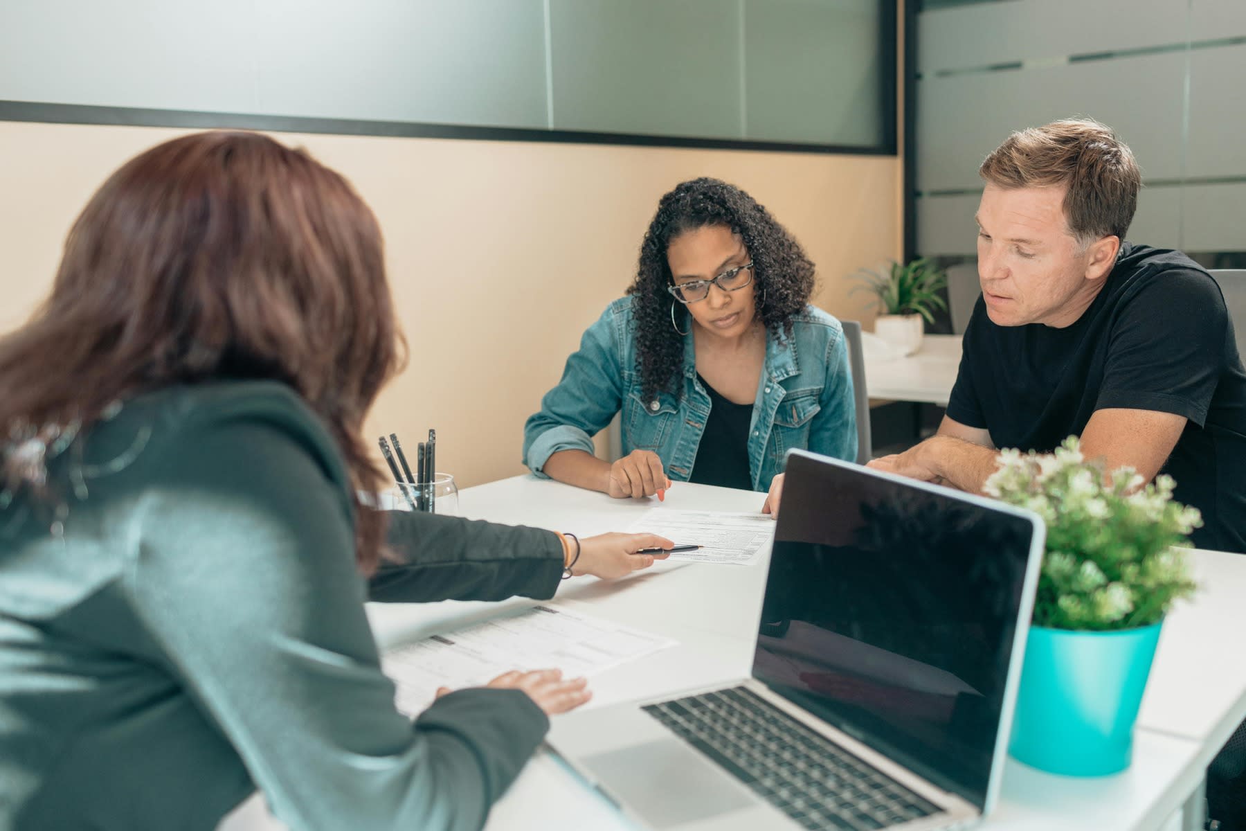 Couple listening to their financial advisor during a meeting