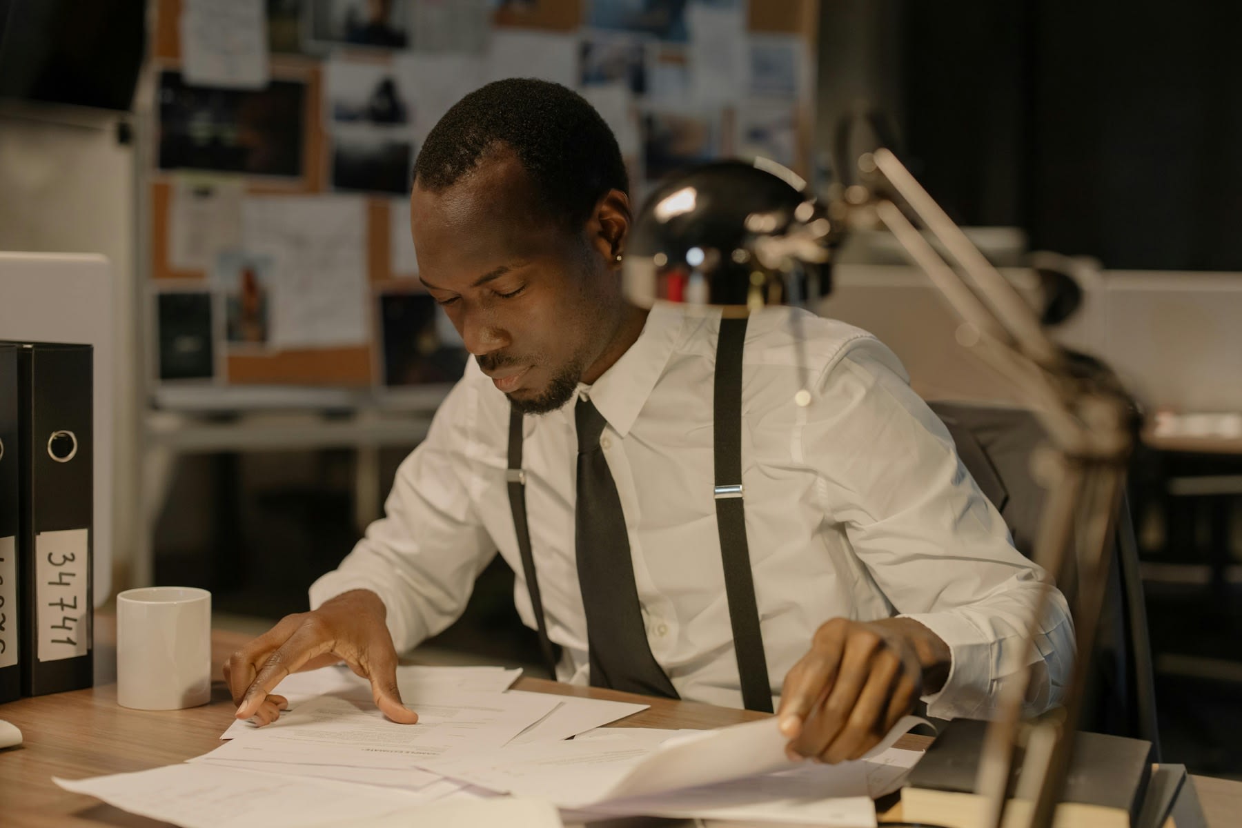 Man reviewing printed reports