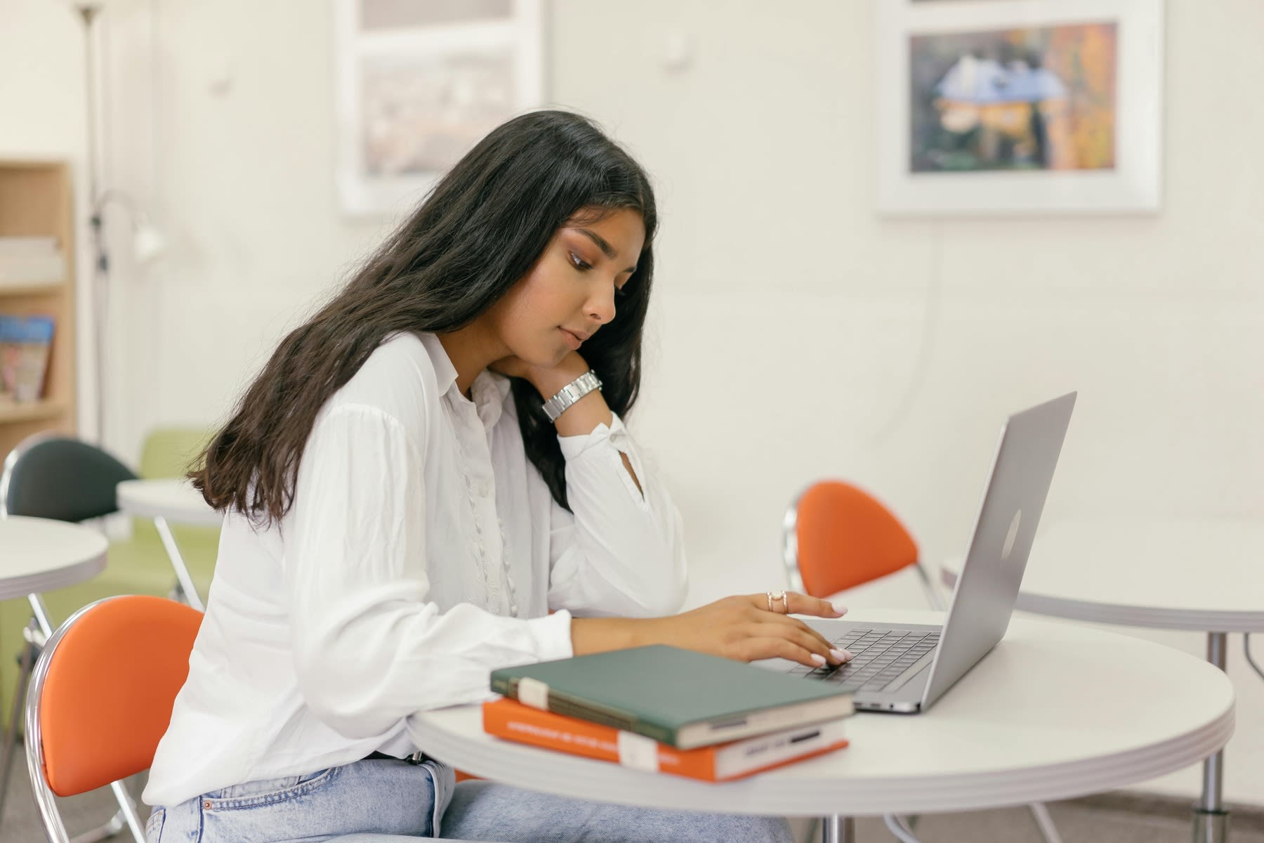 Woman scrolling through her laptop