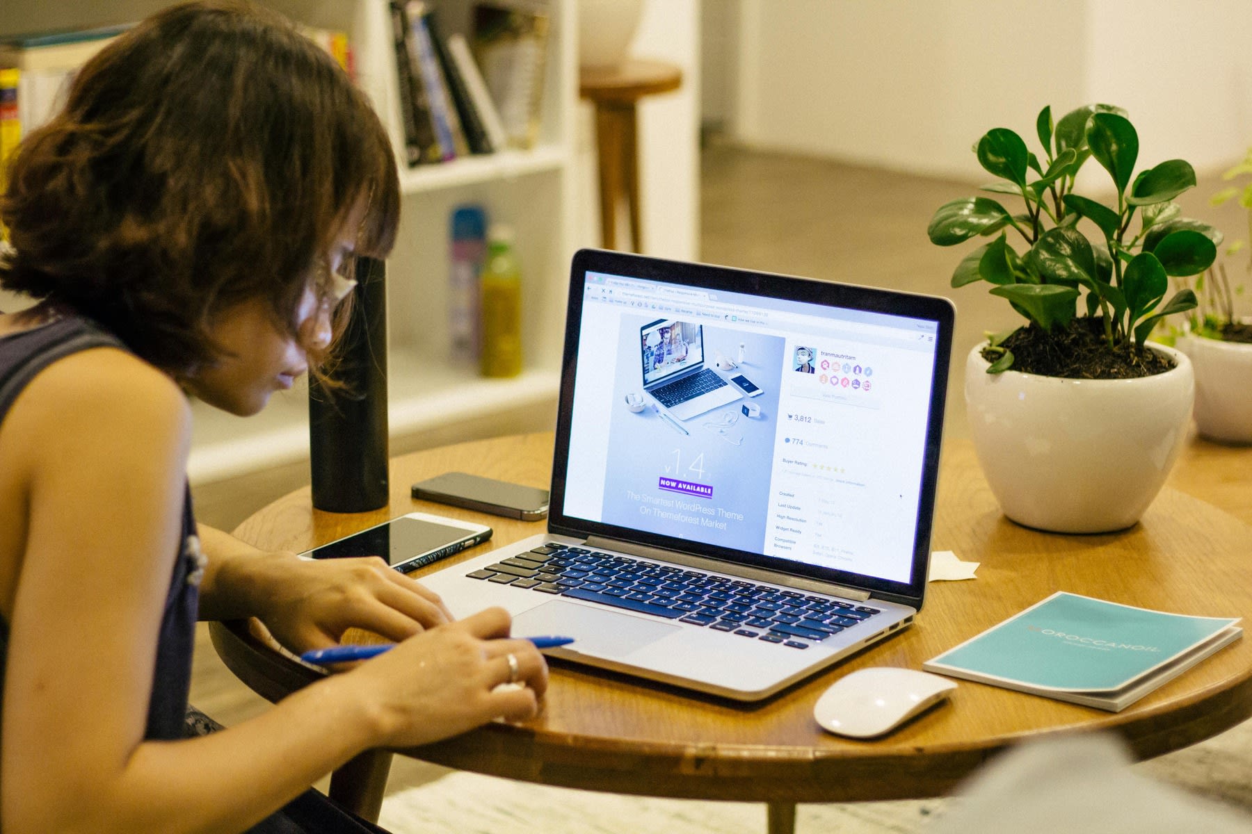Woman working on a project on her laptop