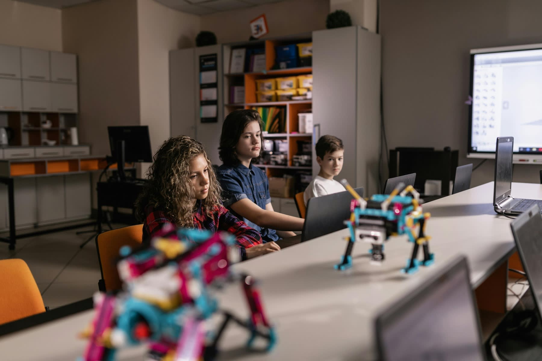 Students using individual laptops for class