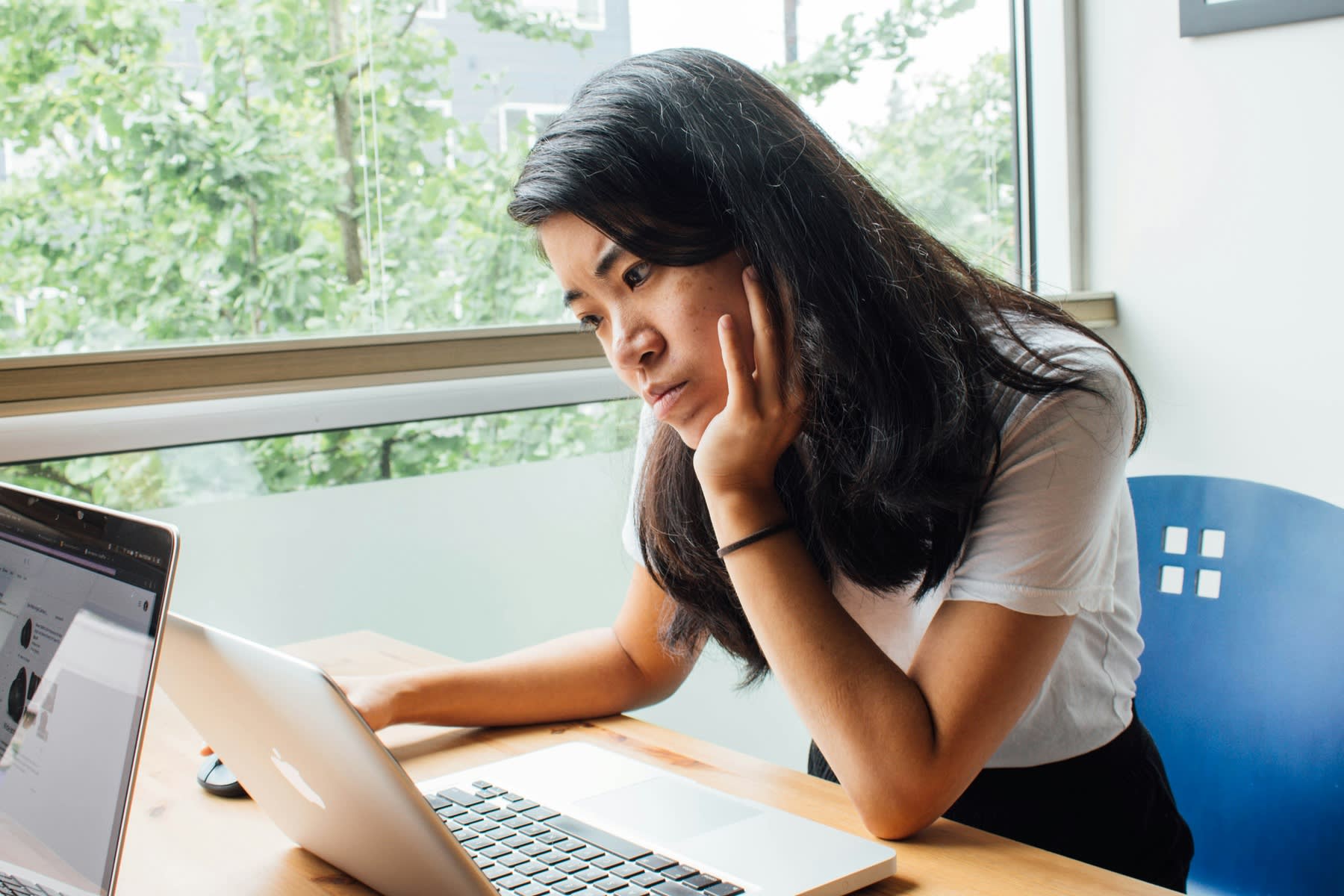 Woman staring at her laptop