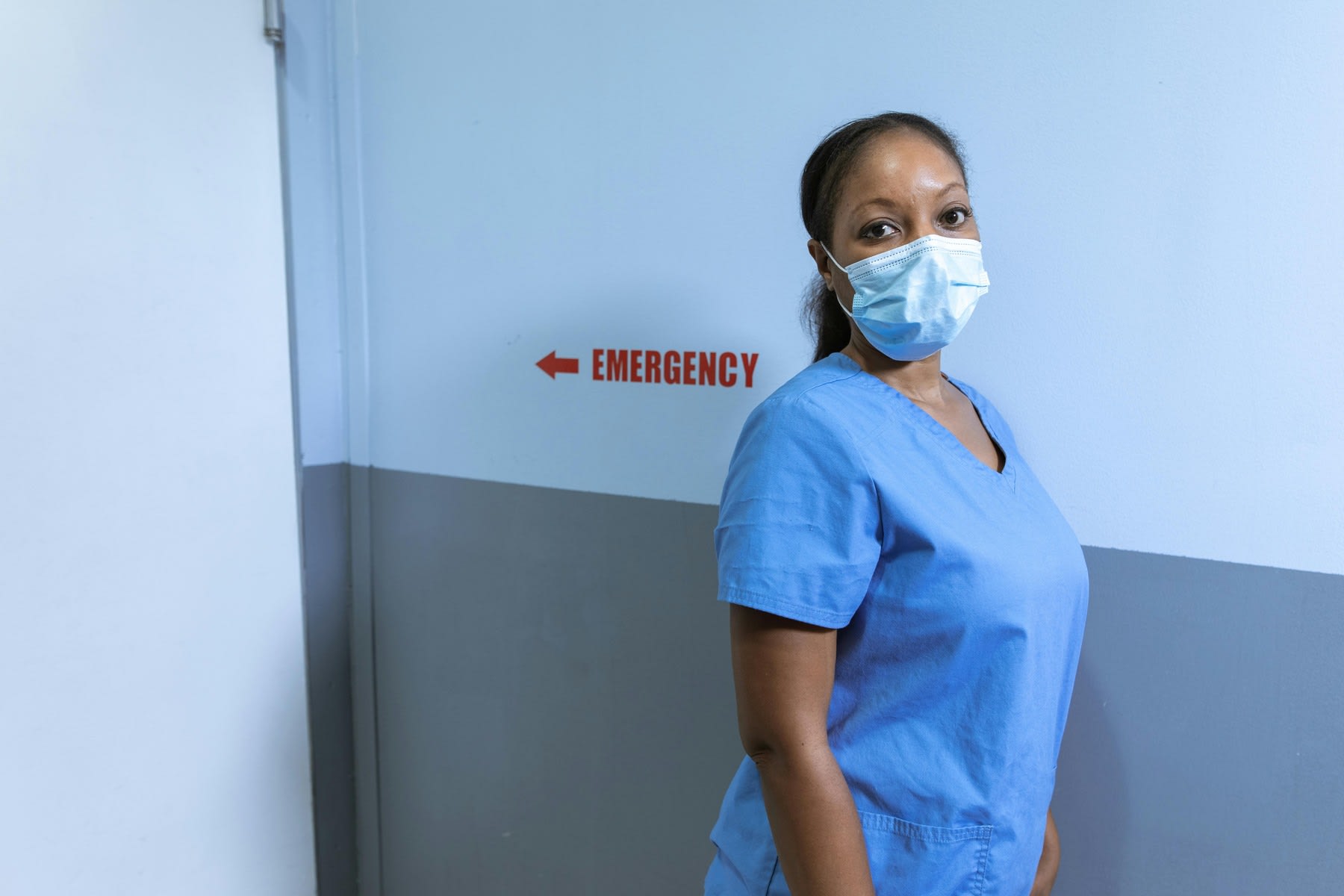 Nurse standing at a section for Emergency services