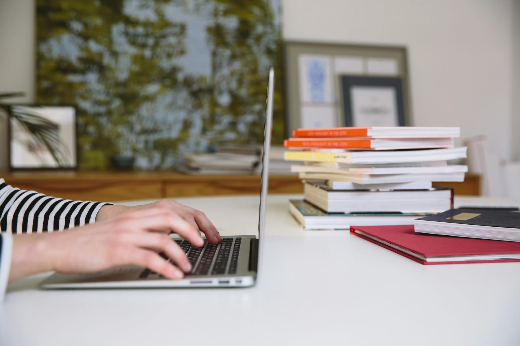 Person typing in a laptop