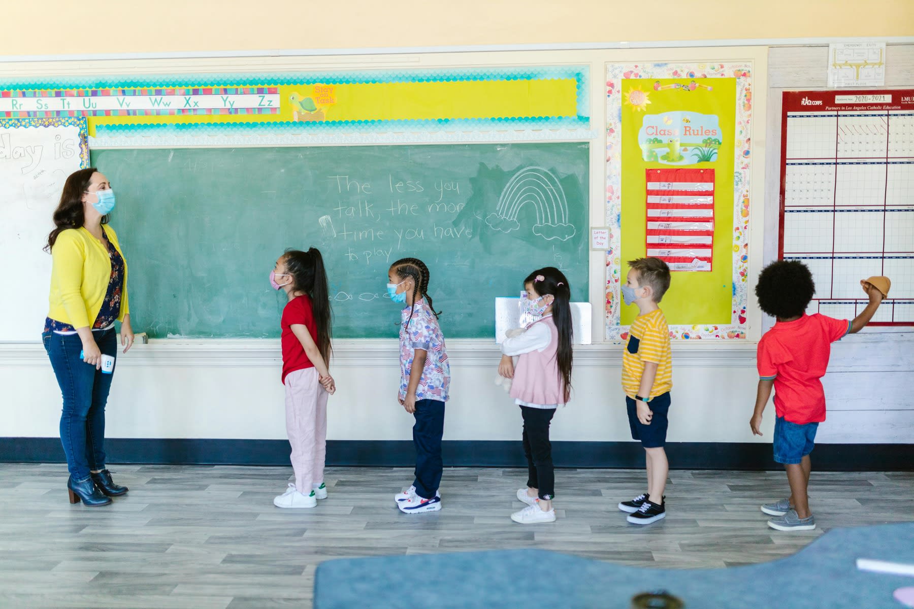 Students lined up in front of their teacher