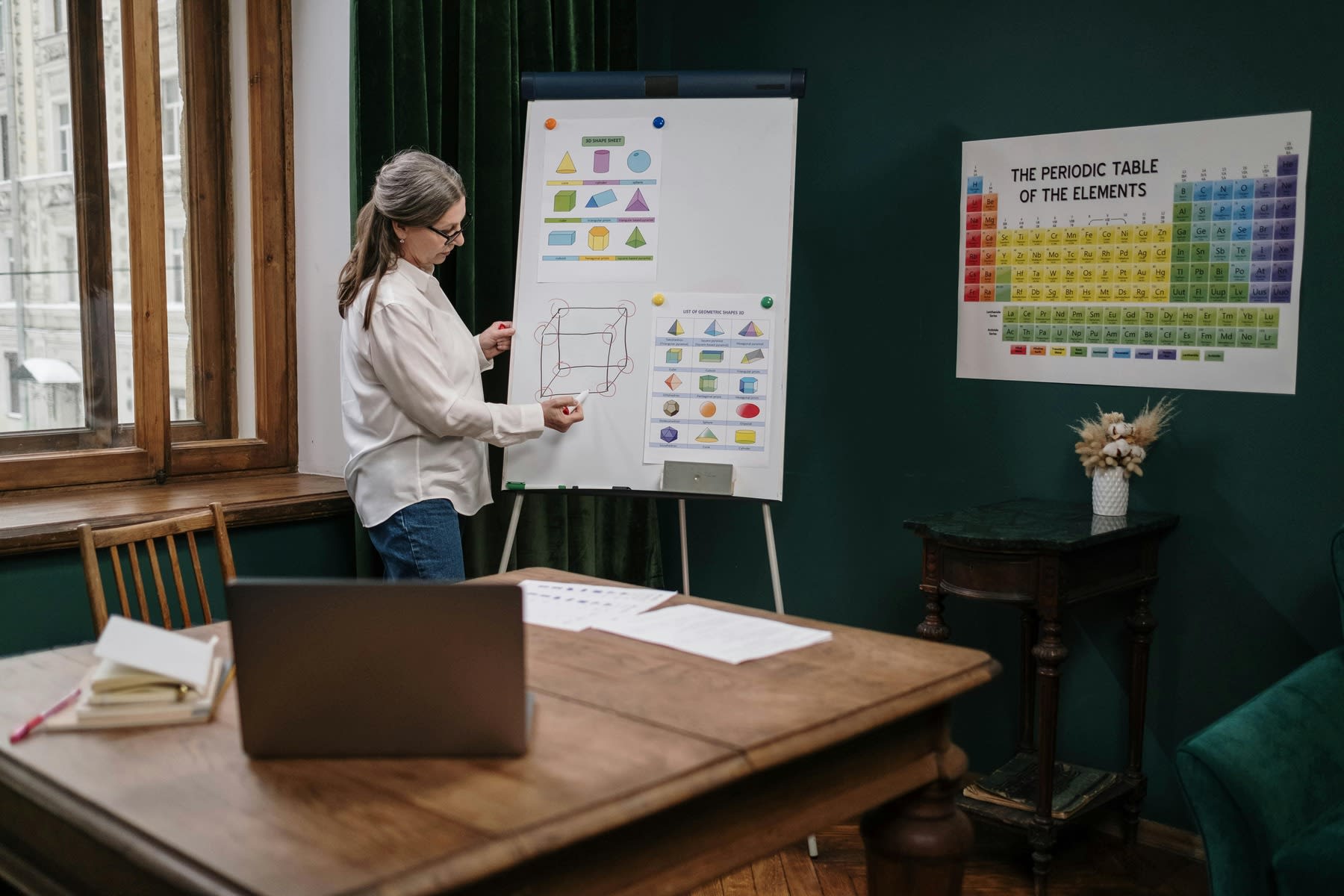 Woman conducting an online class via her home office