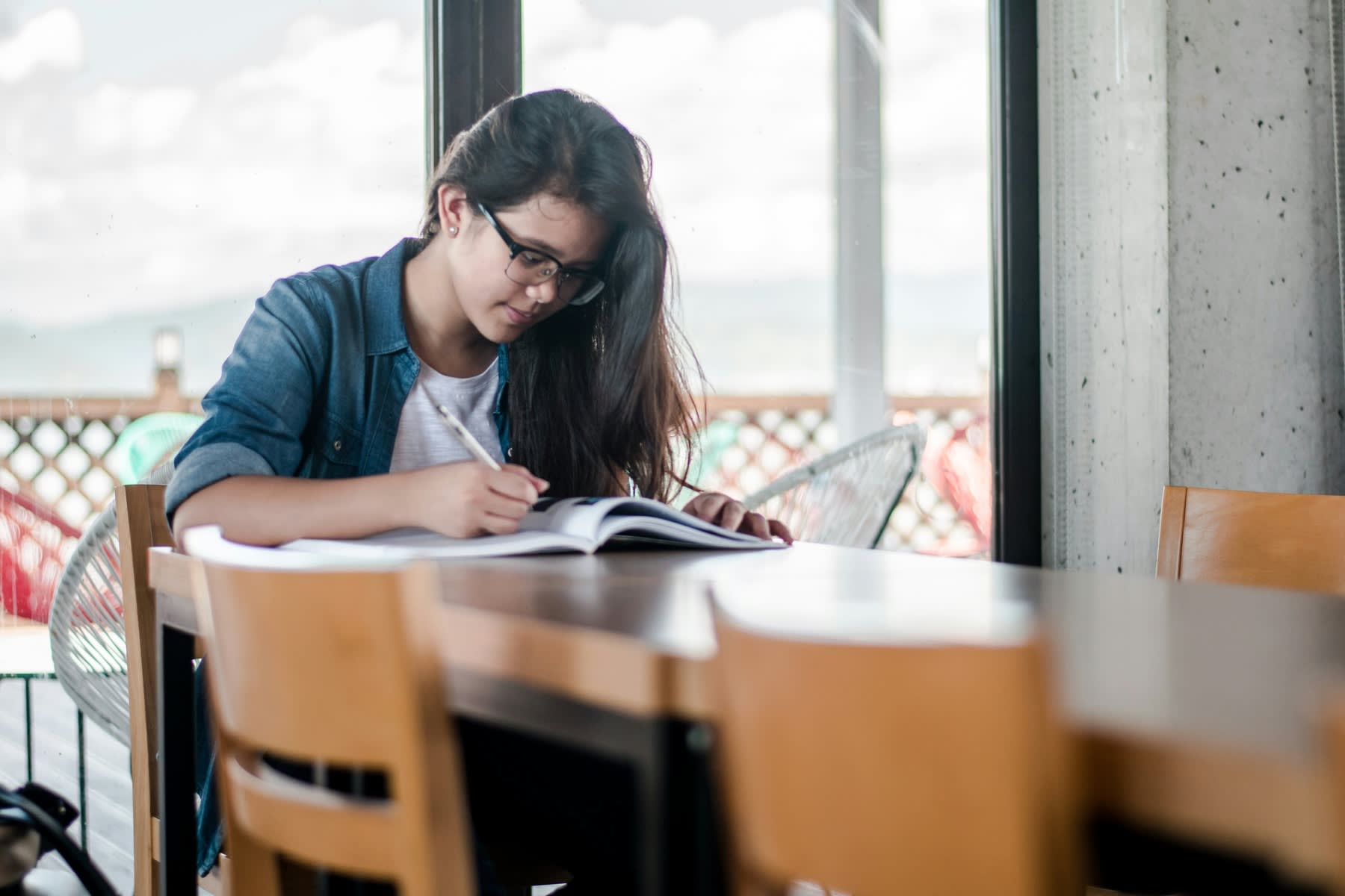 Woman writing on her notebook