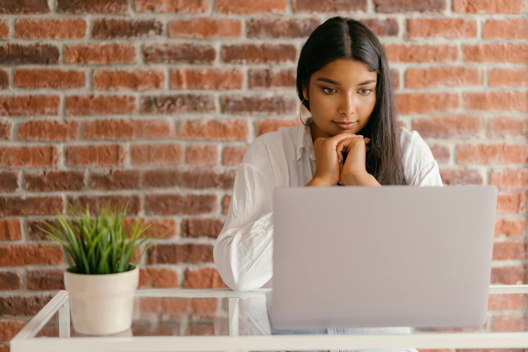 A woman having an online class using a laptop 