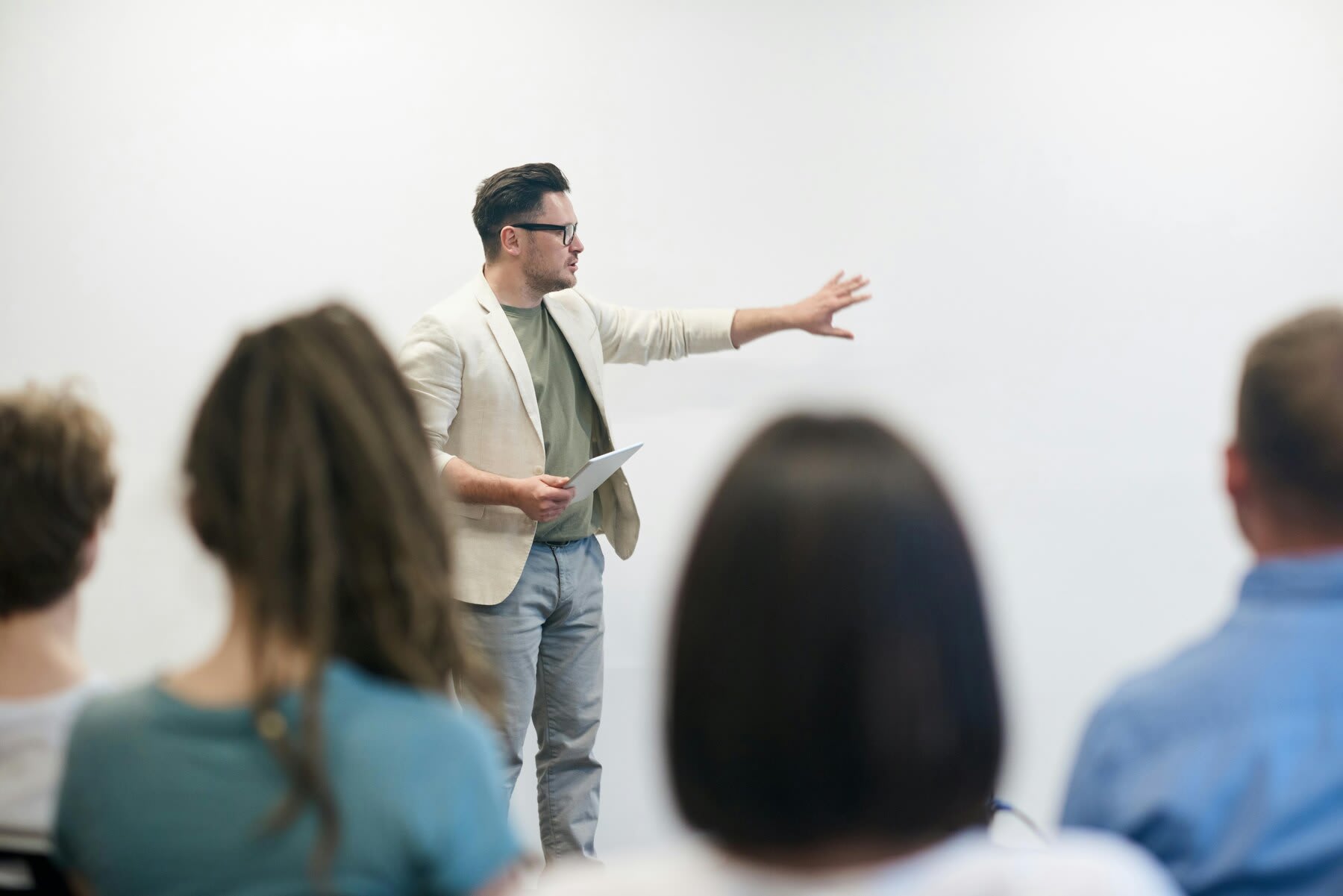 Students listening to a professor's lecture during a college class