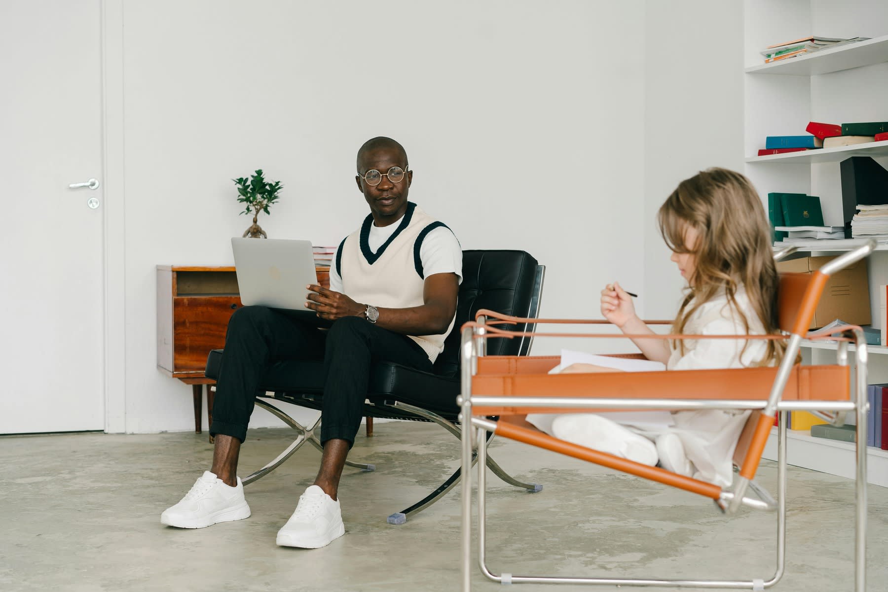 Therapist talking to a child during a therapy session