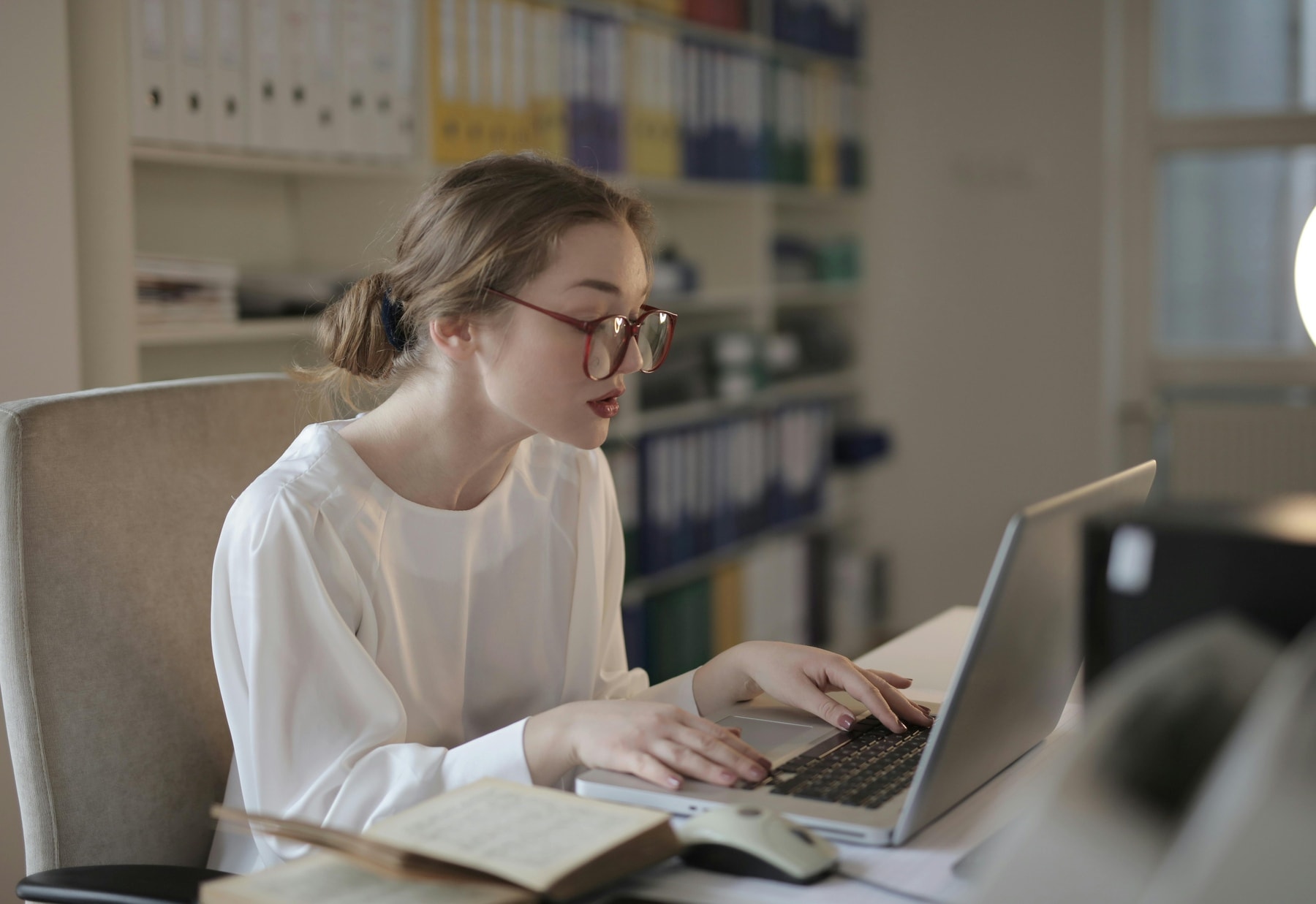 Woman using her laptop for studying