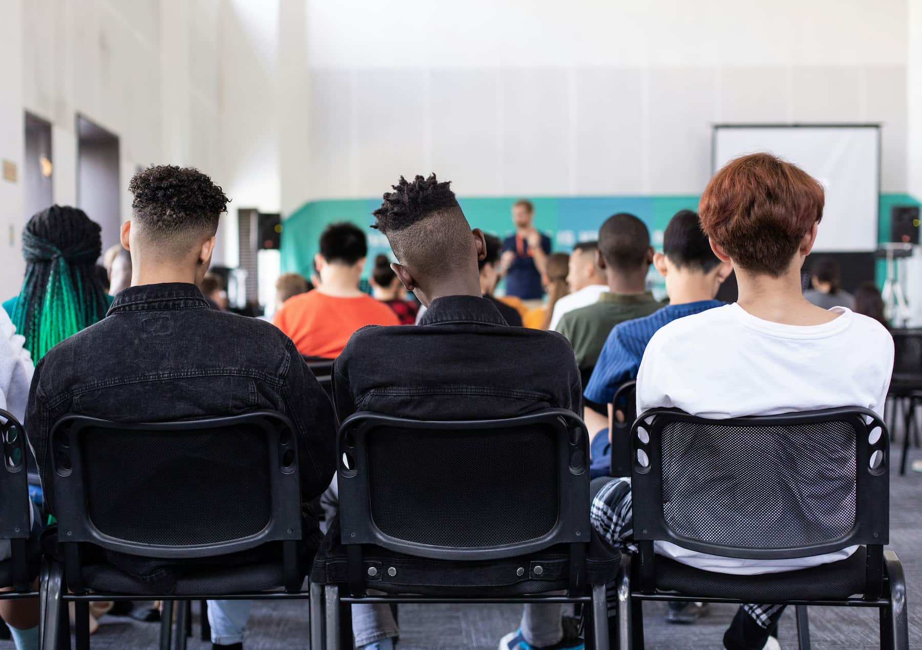 Students sitting and listening to a class lecture