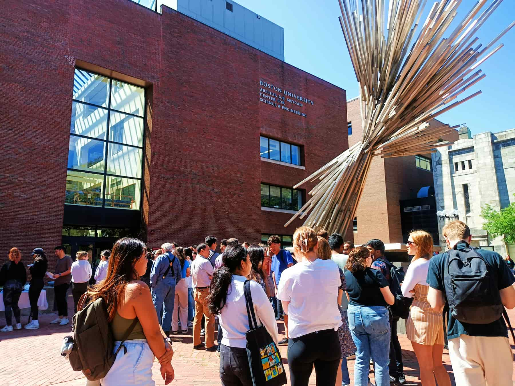 Students gathered in front of a college building