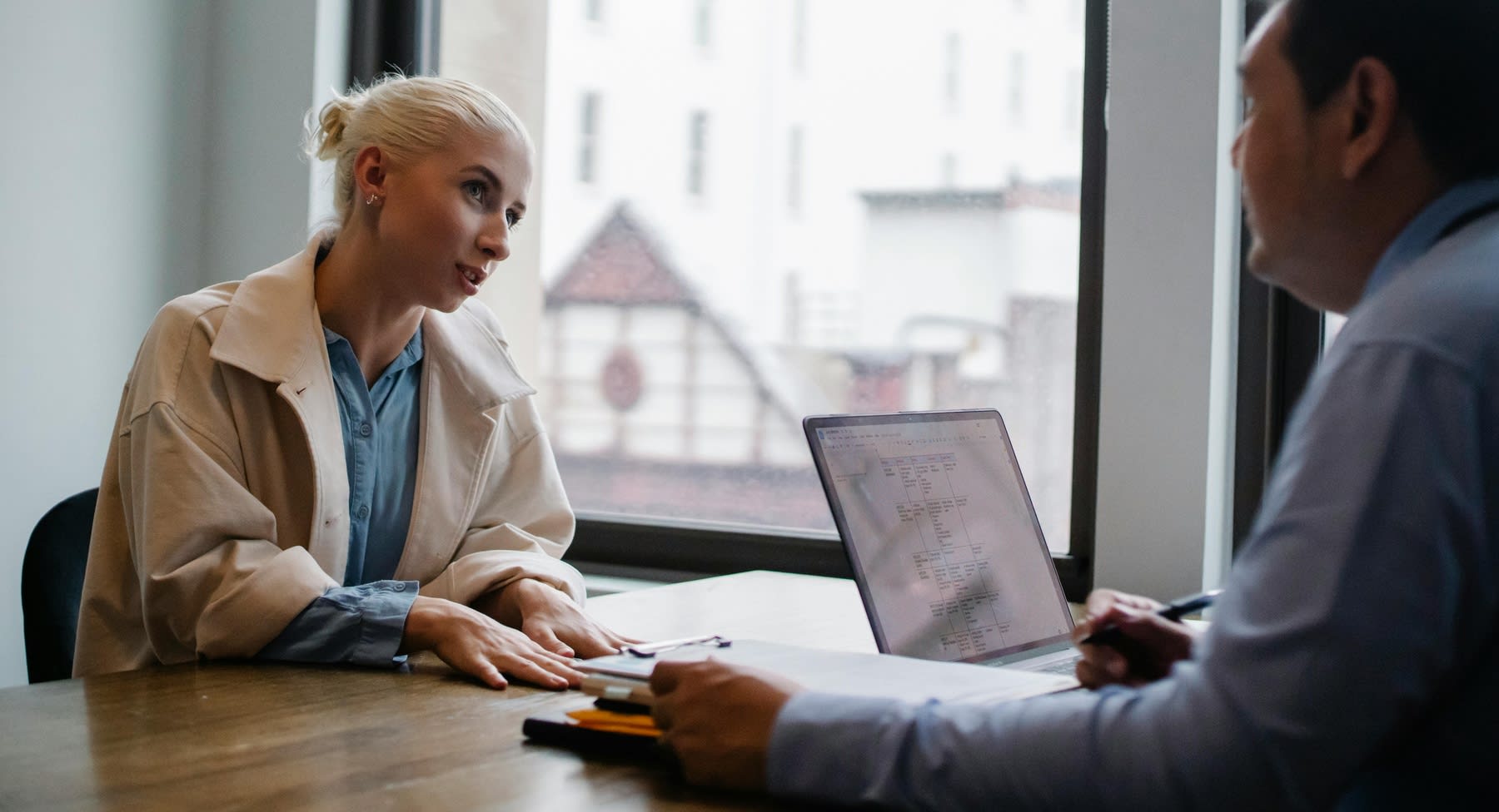 Young woman during an interview with a financial aid advisor