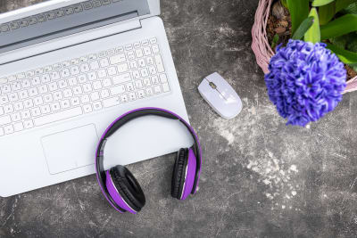 Laptop and headphones on a table