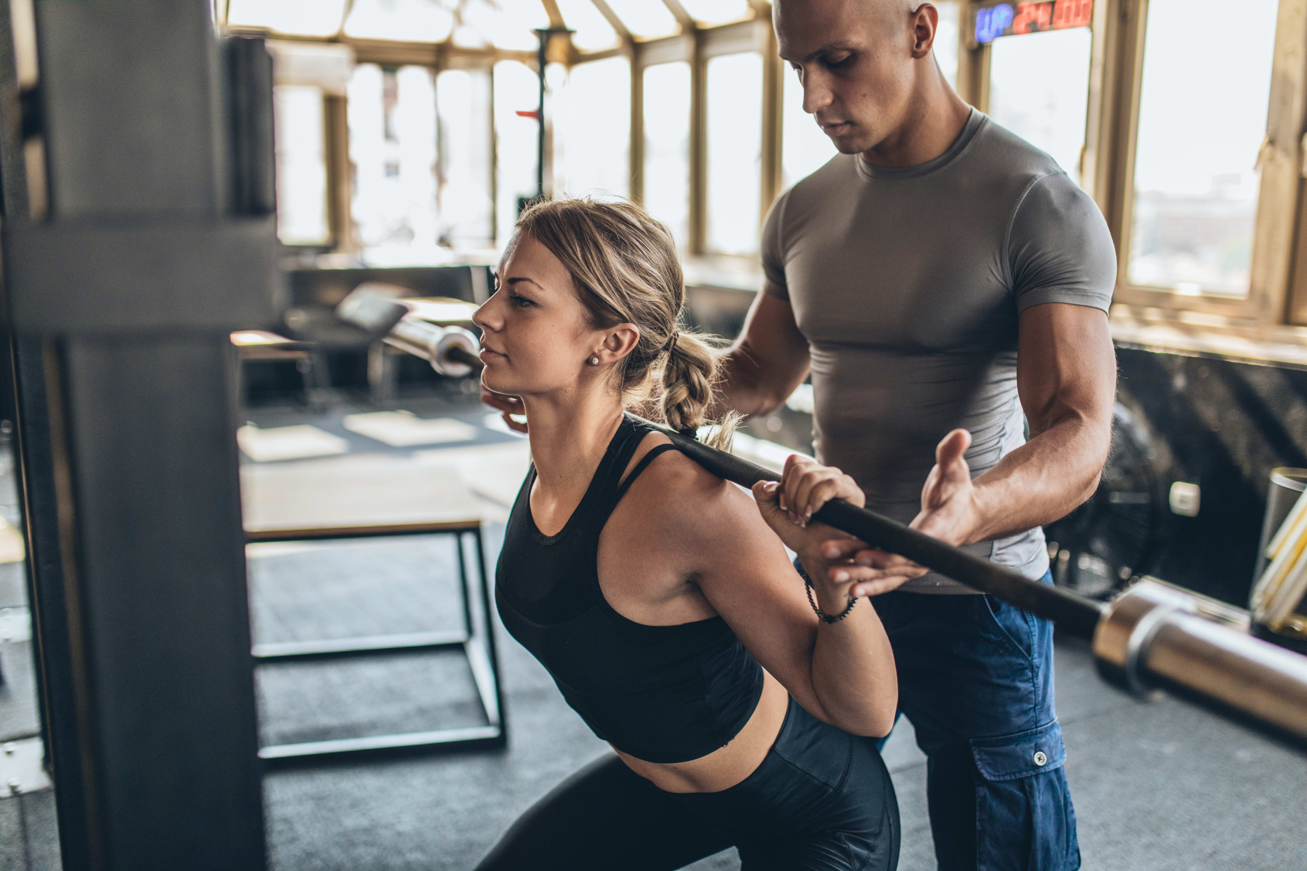 personal trainer working with a client